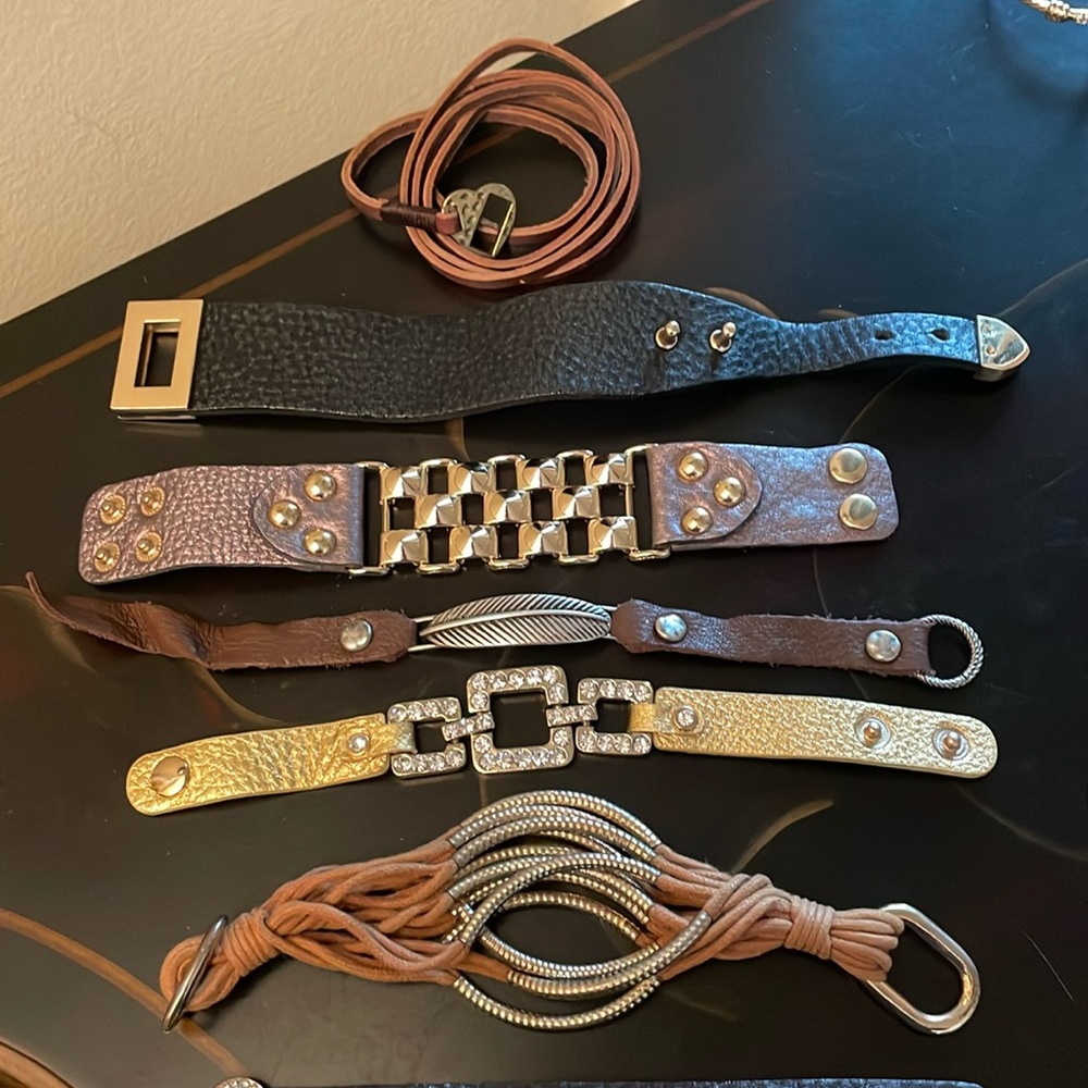 Set of leather bracelets (light tan cloth strings) worn maybe once or twice.